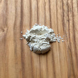 A small pile of DE Guard powder.